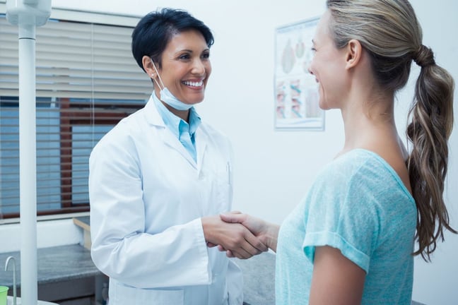Dental practice owner and accountant discussing financial goals